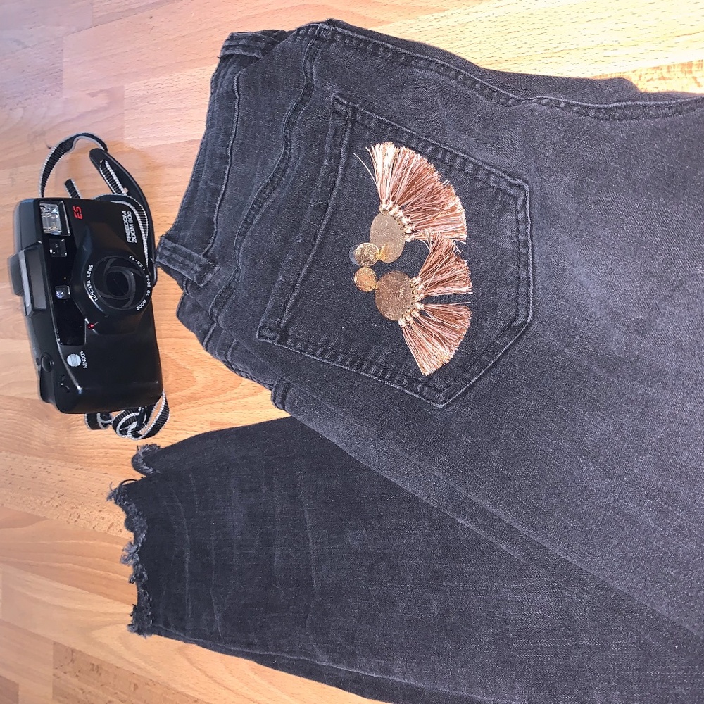 Lighter wash high-rise black skinny jeans.